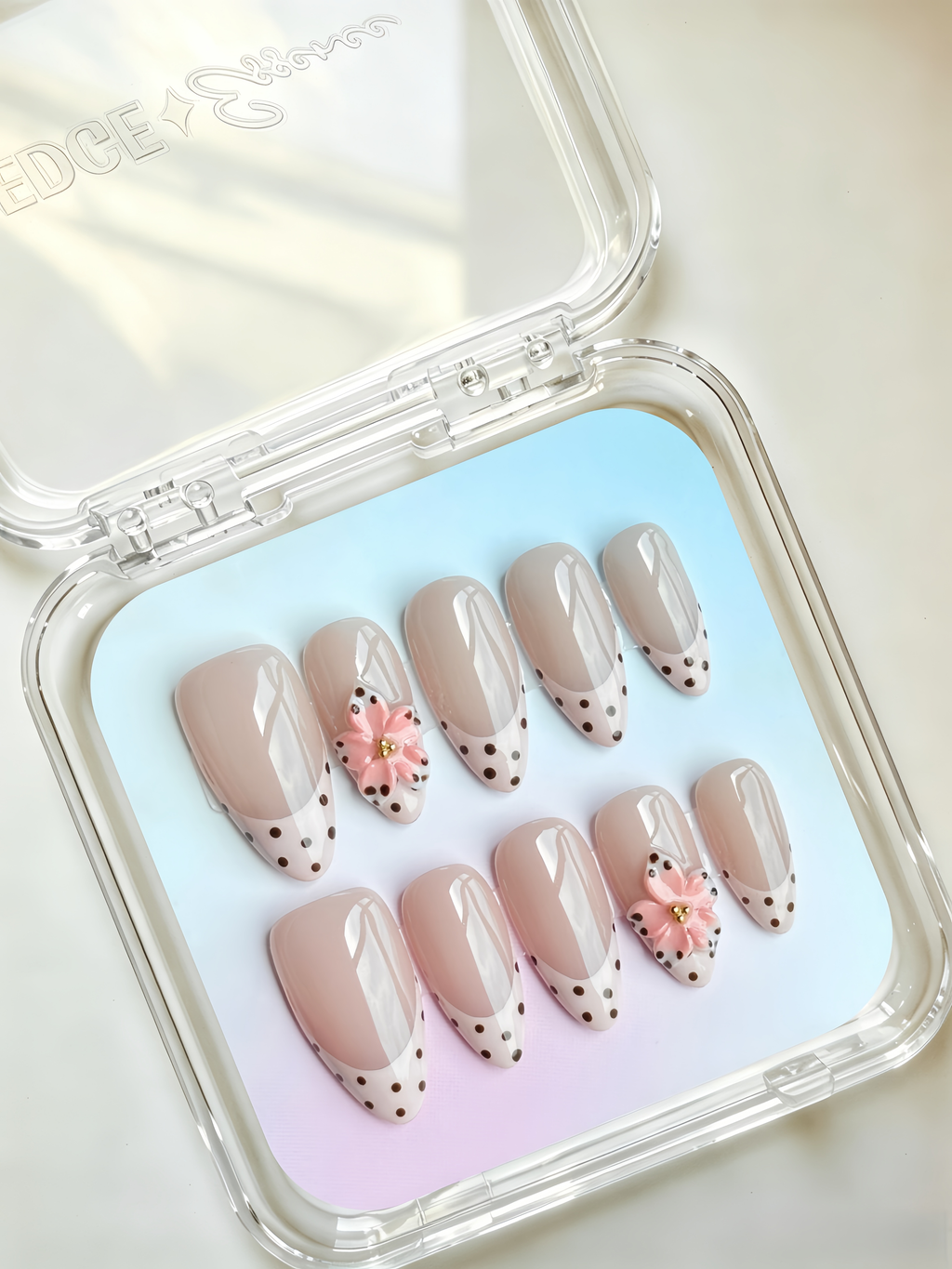 Nude pink floral French almond press-on nails with delicate nail art